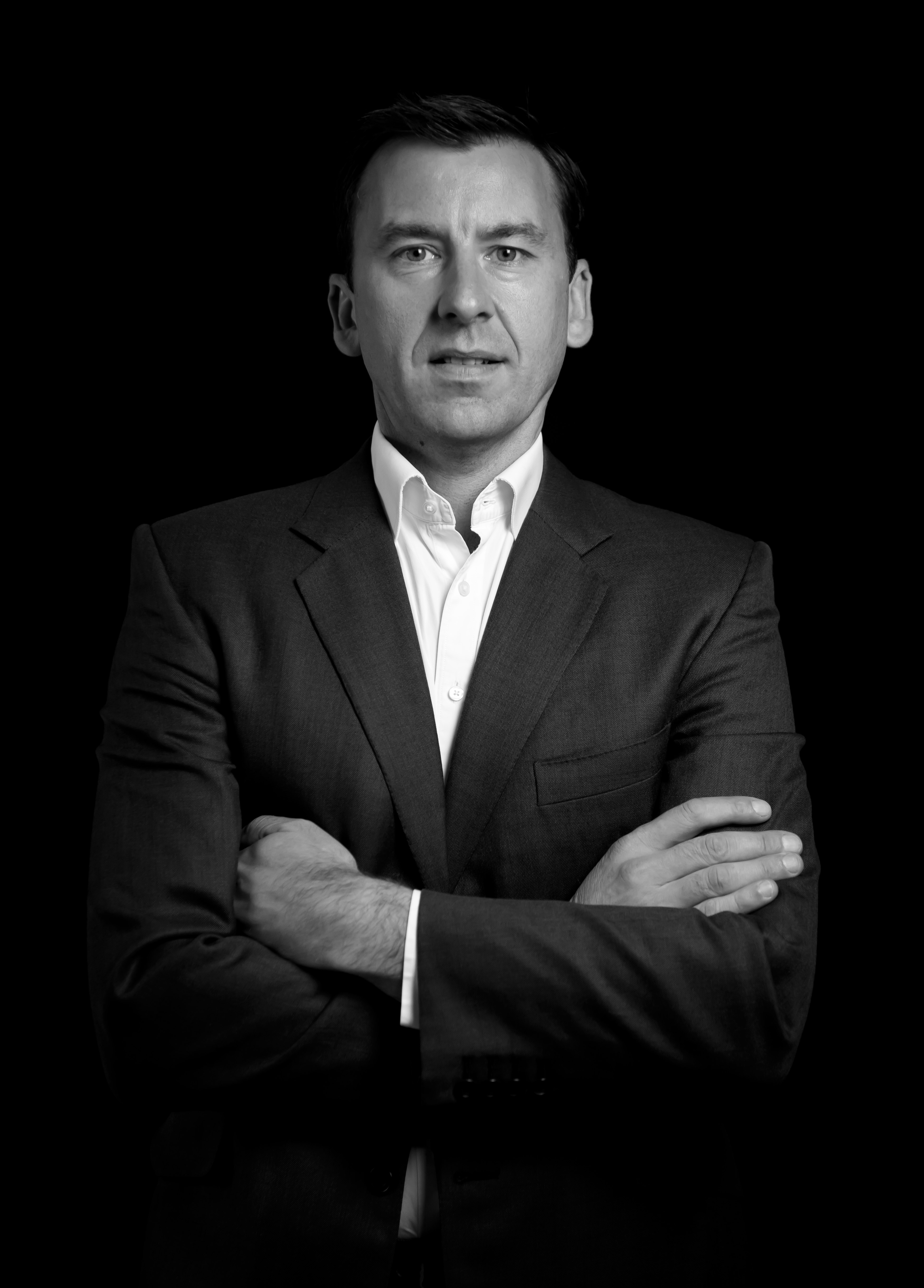 Headshot of Trevor Gill, Founder of Atomic 42